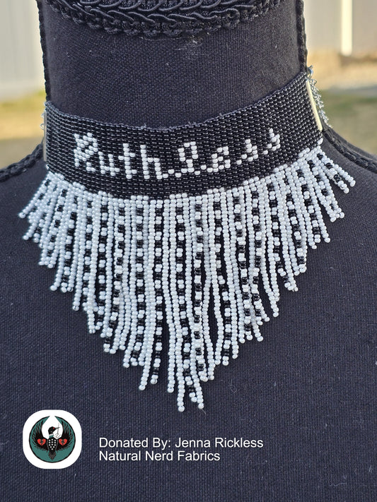 Black and white beaded choker necklace and 'Ruthless' text