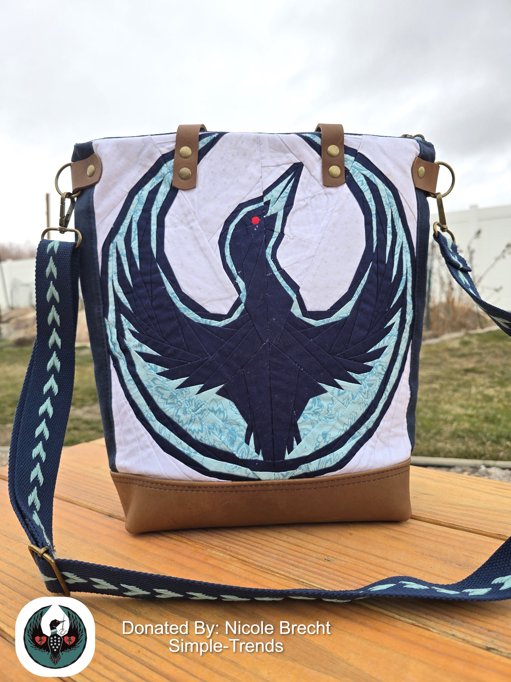 Handbag with a paper pieced Minnesota resist loon on the front