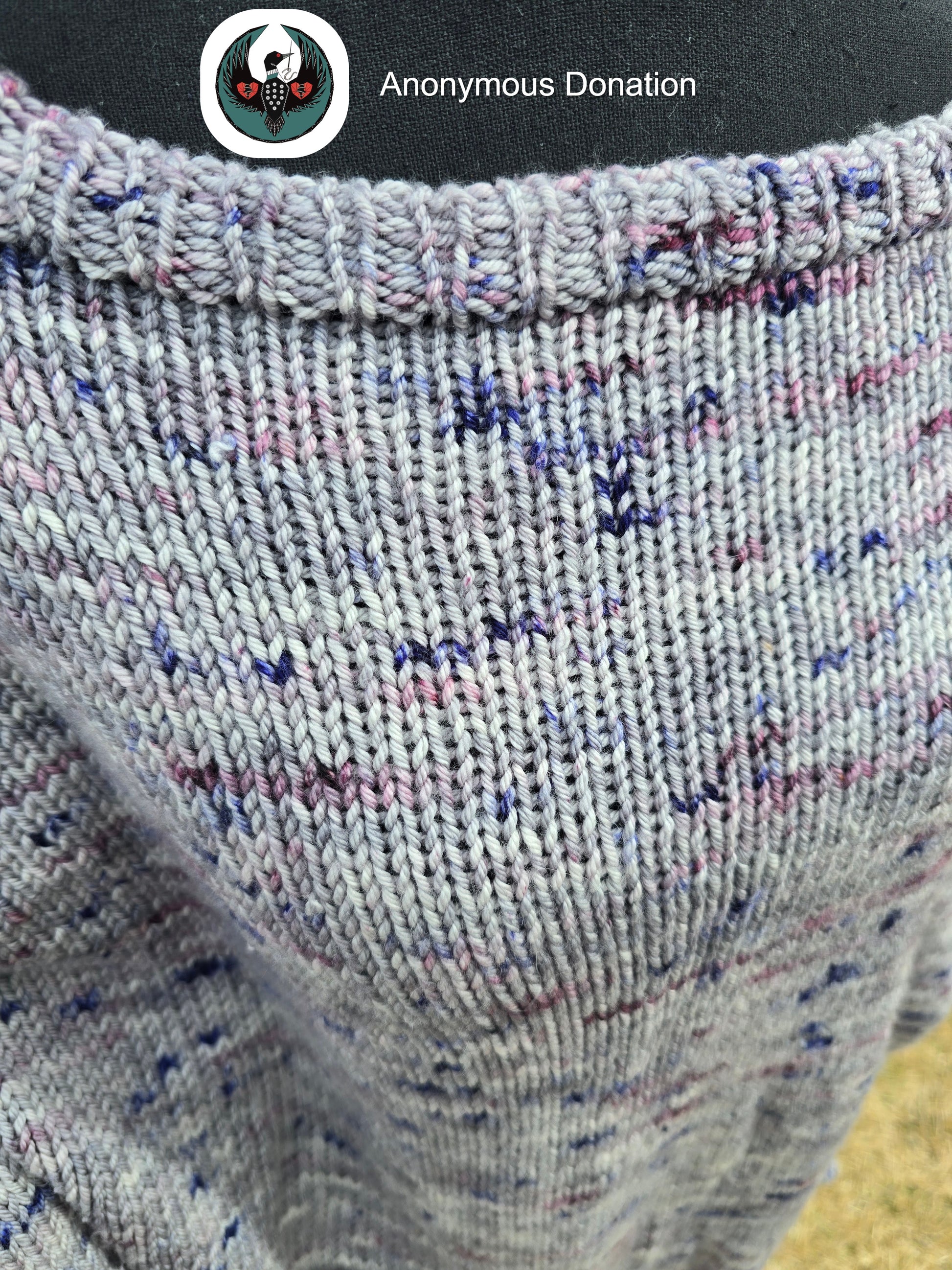 close up of a grey knitted sweater