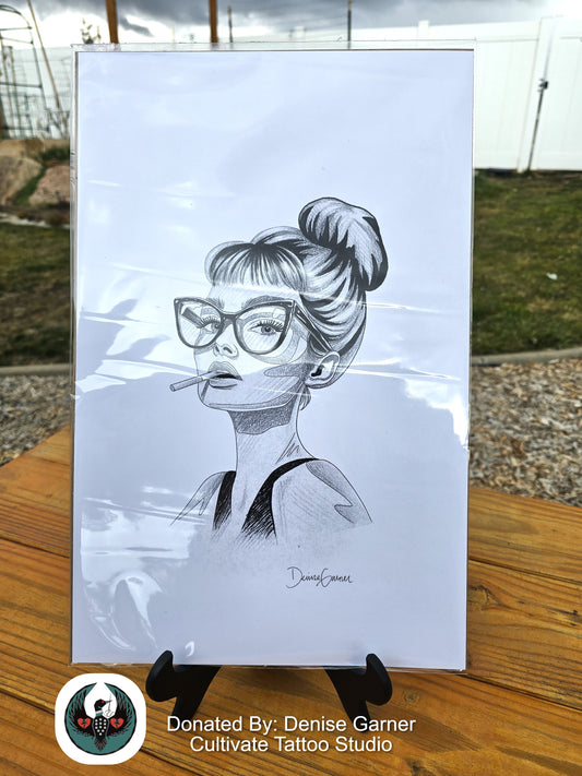 Pencil drawing of a woman with glasses smoking a cigarette on a white background, donated by Denise Garner from Cultivate Tattoo Studio.