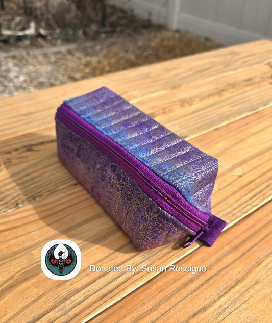 Purple prism zipper pouch on a wooden surface